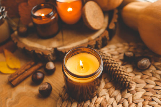 istock Thanksgiving autumn decor, burning candle, pumpkins and candles 1477485565