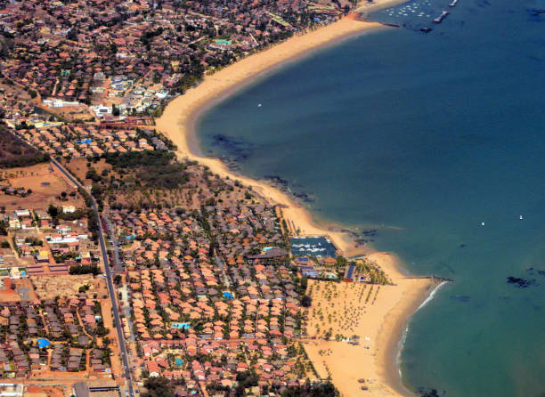 Sandy beaches and waterfront hotels of Saly Portugal, Senegal Saly Portudal, Mbour department, Thiès region, Senegal: seaside resort, turquoise waters, vast beaches of golden sand and waterfront bungalows - the origin of the village was a 15th century Portuguese fort nicknamed "Porto de Ale" (the beer port), a denomination that over time became Portudal. senegal beach stock pictures, royalty-free photos & images