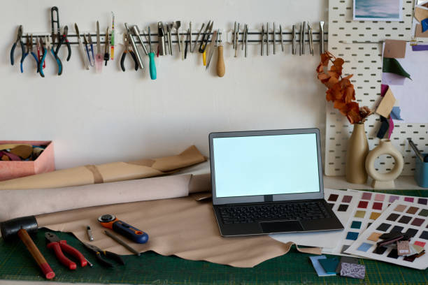istock Laptop with blank screen standing on workplace of tanner 1477486087