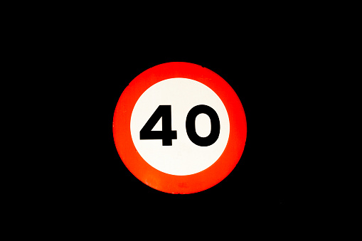 speed limit traffic sign at 40 km hour horizontal black background