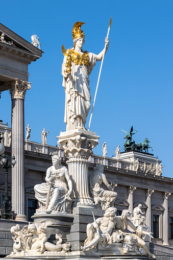 Pallas Athena fountain group showing allegory of democratic virtues unveiled in 1902 in front of the Austrian Parliament building by Austrian sculptor Carl Kundmann (1838-1919)