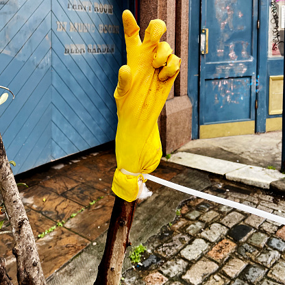 Rubber glove on a stick out side a pub