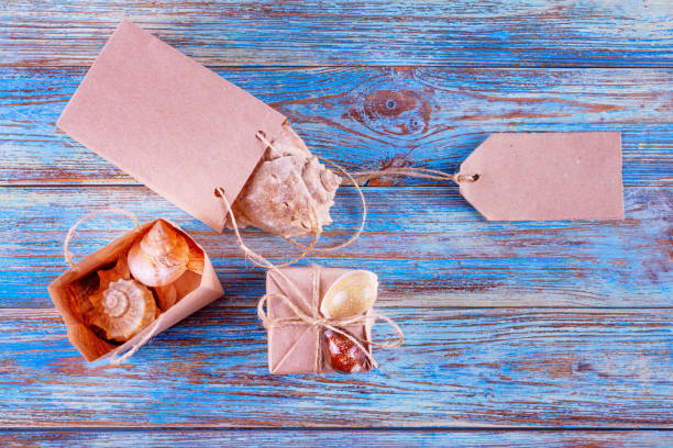 istock View of souvenirs with seashells in gift bags with space for greeting text 1477494556