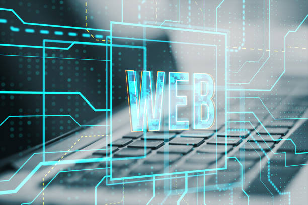istock Close up of laptop with glowing linear web text hologram on blurry background. Digital nft, technology and future concept. Double exposure. 1477494805