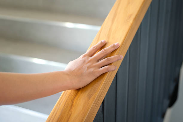 istock Holding the handrail during walking up the stair. 1477496055