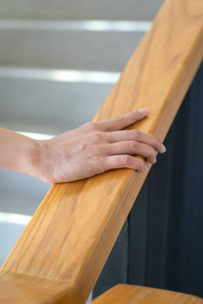 istock Holding the handrail during walking up the stair. 1477496103