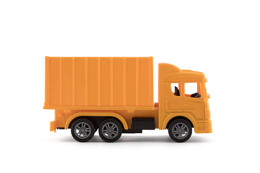 Yellow cargo delivery truck miniature isolated on white background with clipping path