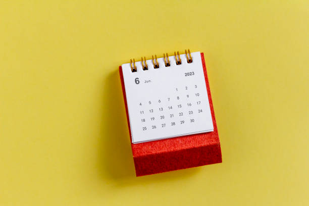 istock Desktop calendar for June 2023 on a yellow background. 1477498275