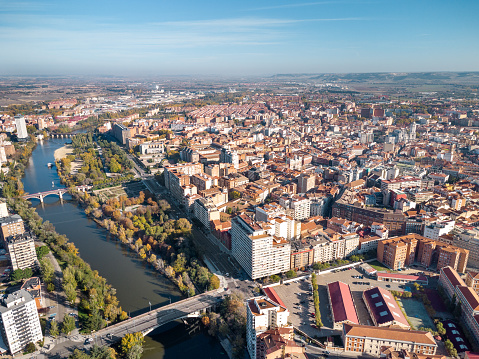 Aerial point of view of Valladolid city. View of River Pisuerga and Juan de Austria Bridge. At the right is the city center of Valladolid. Travel destination in Spain.