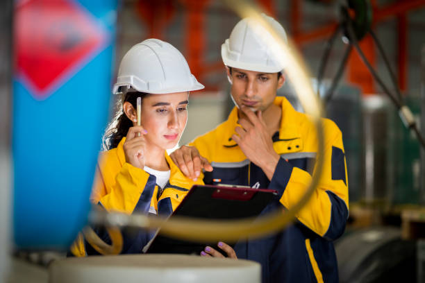 istock A new generation of engineers in a metal sheet factory.  Studying work methods from supervisors or colleagues and studying by yourself  be taught professionally 1477503719