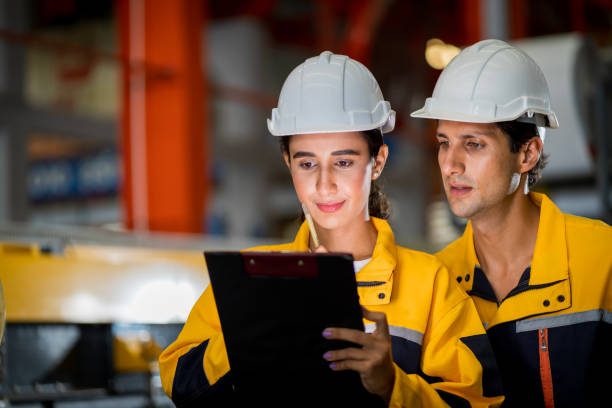 istock A new generation of engineers in a metal sheet factory.  Studying work methods from supervisors or colleagues and studying by yourself  be taught professionally 1477504172