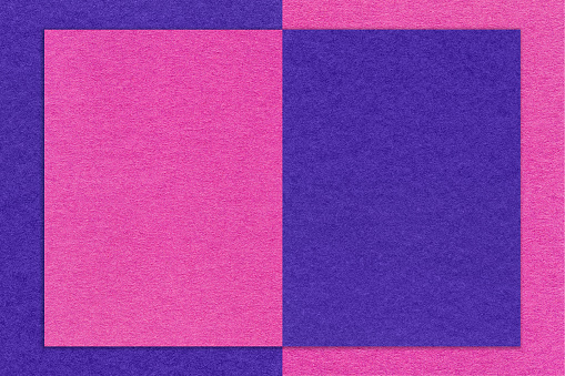 Texture of navy blue and purple paper background with geometric shape and pattern, macro. Structure of craft magenta and indigo cardboard with frame. Felt abstract violet backdrop.