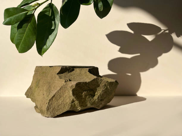istock Stone podium on beige background.Product promotion.Front view, studio photography. 1477506517