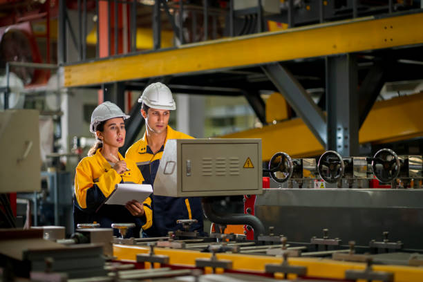 istock A new generation of engineers in a metal sheet factory.  Studying work methods from supervisors or colleagues and studying by yourself  be taught professionally 1477506789