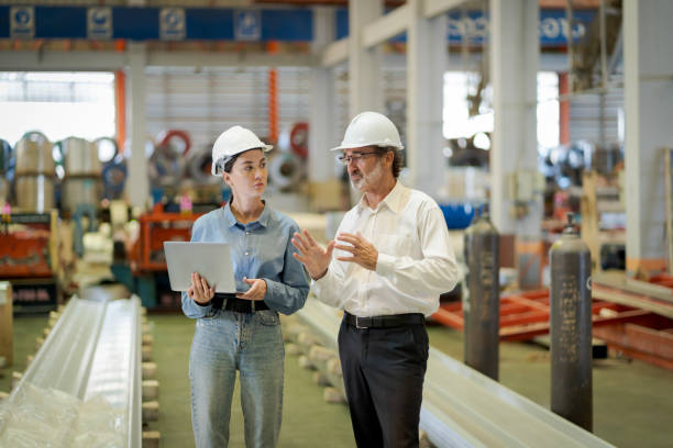 istock A new generation of engineers in a metal sheet factory.  Studying work methods from supervisors or colleagues and studying by yourself  be taught professionally 1477508037
