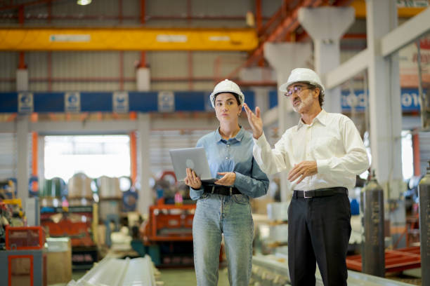 istock A new generation of engineers in a metal sheet factory.  Studying work methods from supervisors or colleagues and studying by yourself  be taught professionally 1477508160