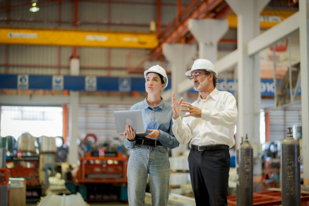 istock A new generation of engineers in a metal sheet factory.  Studying work methods from supervisors or colleagues and studying by yourself  be taught professionally 1477508261