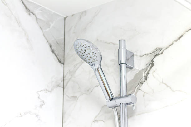istock Shower head on marble bathroom wall background 1477509916