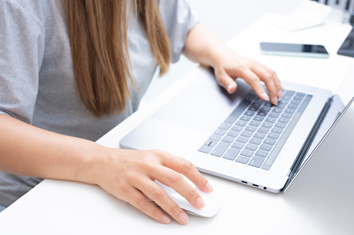 Woman using her laptop for working from home