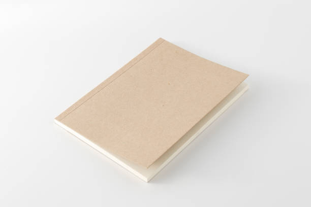 istock Recycled paper book on white background 1477510575