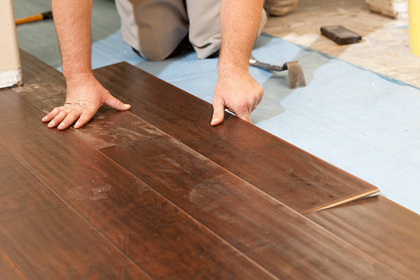 istock Man Installing New Laminate Wood Flooring 147751189