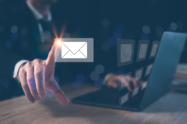istock Email concept, businessman using computer laptop on table in office blurred background 1477513311
