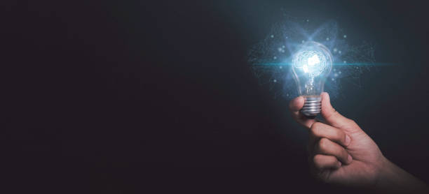 istock Artificial intelligence of futuristic Innovative technology concept. Businessman hand holding light bulbs or lamp thinking ideas with AI brain genius analysis business in black background. 1477516255