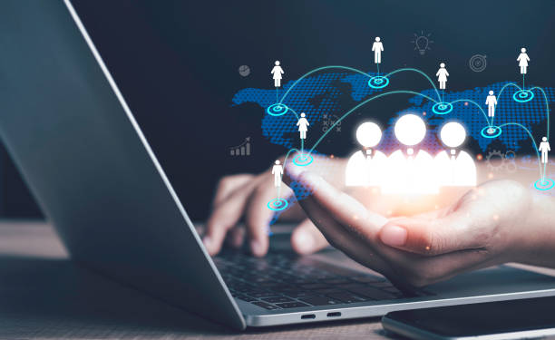 istock CRM. Customer network relationship management concept. Businessman use laptop with map global structure customer network technology. Social network marketing online connection system process. 1477516422