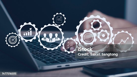 istock Operation management Business process control optimisation industrial technology and workflow concept. High performance, Problem solving, quality control. Hand using laptop with virtual gears icons . 1477516505