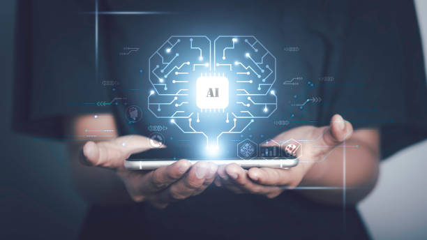 istock Artificial intelligence of futuristic technology concept. Hand hold smartphone show virtual circuit AI brain genius technology link to big data network and analytic information. 1477517128