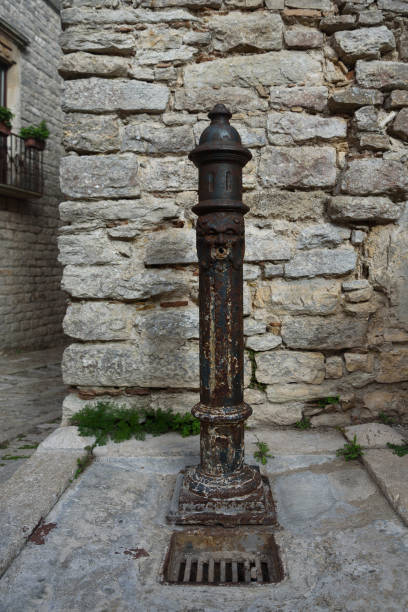 istock Old water pump on the street. 1477517234