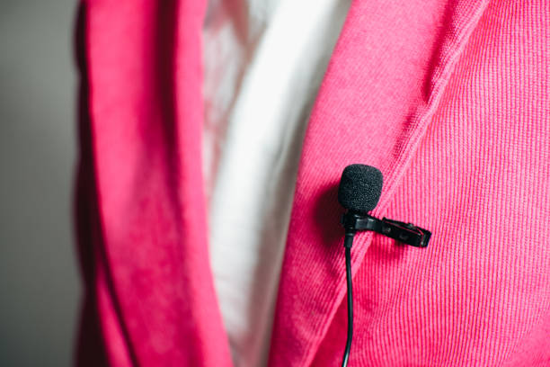istock Lavalier microphone.Clip-on compact  microphone for audio recording for television, journalism, theatre, bloggers and performances. 1477517485