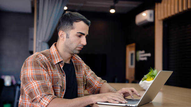istock He is checking work and talking staff, through video call on laptop computer, with serious expression gestures that are not satisfied with work that must be resolved repeatedly. 1477519507