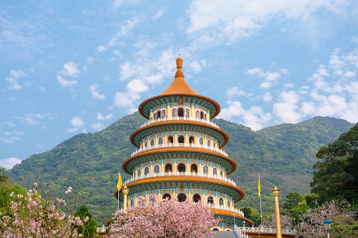 Tianyuan temple with spring cherry blossoms in Tamsui, New Taipei City, Taiwan