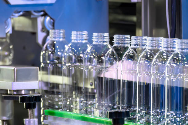 istock The  empty drinking water bottles  on the conveyor belt for filling process. 1477521801