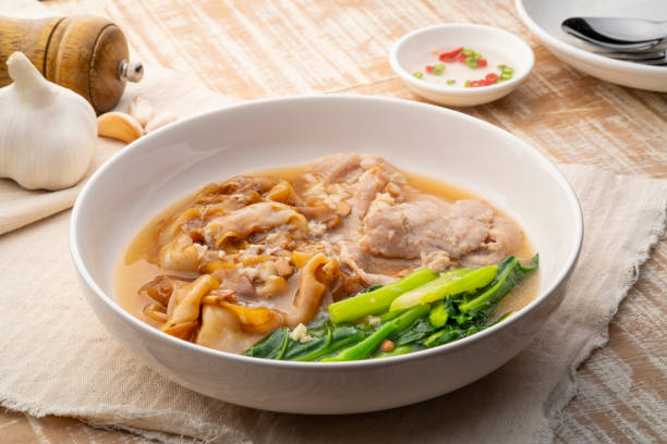 istock Flat Noodles with Marinated Pork and Collard greens in Gravy Sauce 1477522218