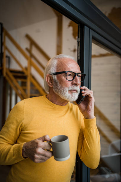 istock A gray-haired elderly man enjoys his morning coffee on the terrace 1477524051