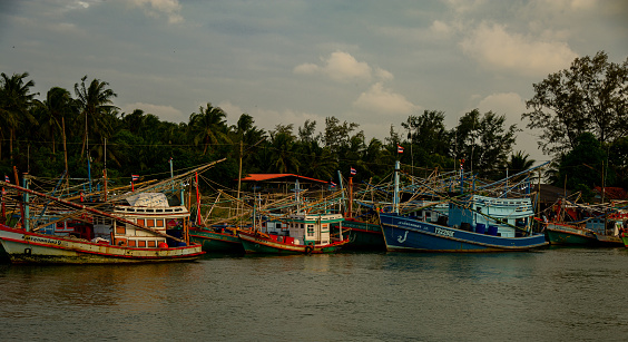 December 16 2022- Pathio Thailand Chumphon area- Colorful fishing boats coming with the tide from the sea and washed ashore due to the storm.