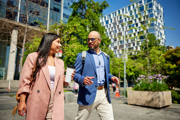 istock White collar coworkers walking together in office park 1477528068