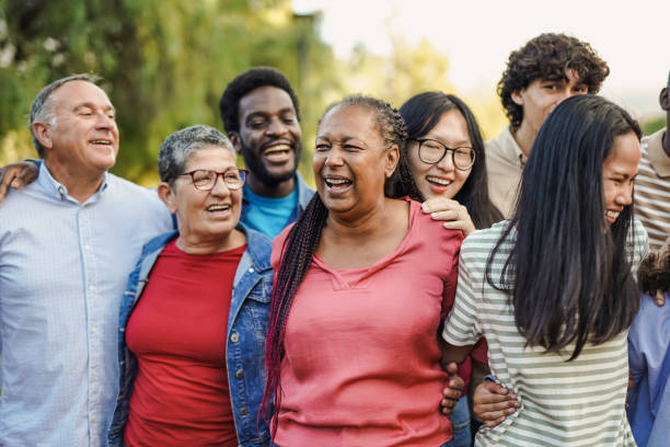 istock Happy multi generational people having fun together at city park while hugging each other - Multiracial friends concept 1477530455