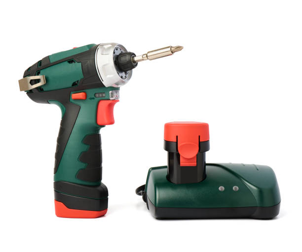 istock Wireless screwdriver with charger and spare battery on white background 1477532702