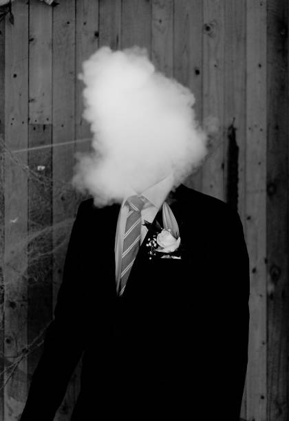 Man with smoke A man smoking his electronic cigarette at a wedding mothman stock pictures, royalty-free photos & images