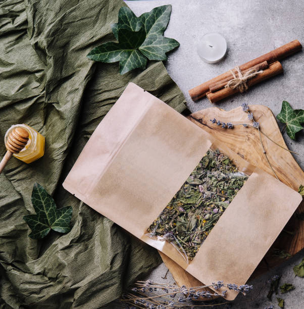 istock Dried and fresh tea leaves with tea, honey and cinnamon 1477535382