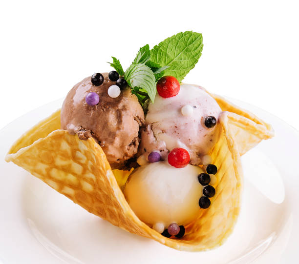 istock Three scoops of natural organic fruit ice cream in a wafer cup 1477535500