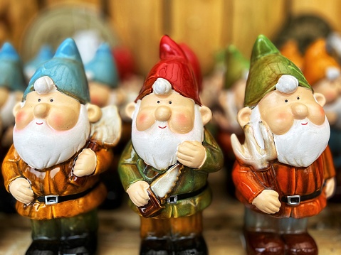 A retail display of garden gnomes for sale in the garden store. Selective focus with room for copy space.