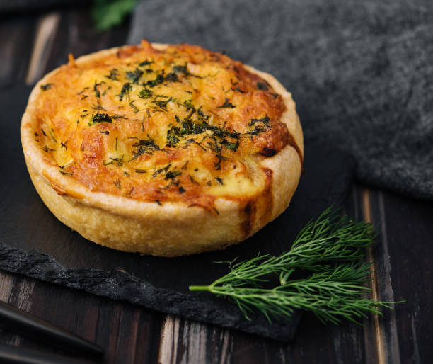istock Cheddar cheese and spring onion omelette tarts served on wooden board 1477536000
