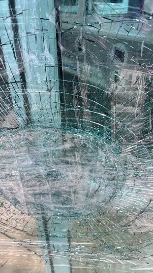 Masses of cracked and broken glass of windows