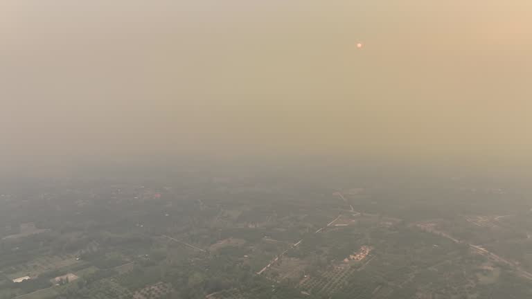 Haze and smoke covering by agricultural burning impact city