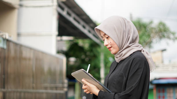 istock young hijab women using tablet in outdoor 1477540192