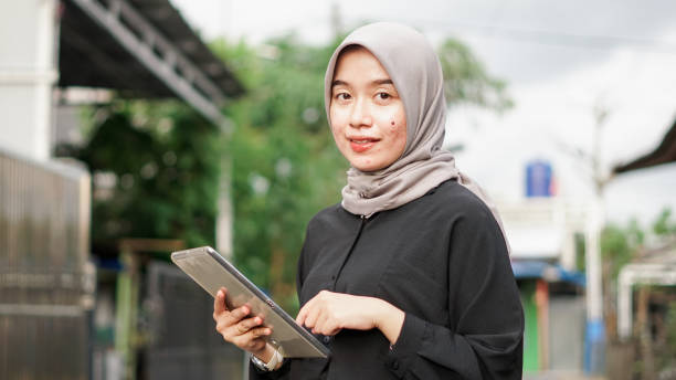 istock young hijab women using tablet in outdoor 1477540765